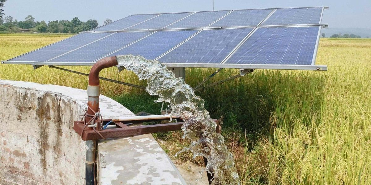 Solar water pump running beside a rice field, installed by Extreme Energy